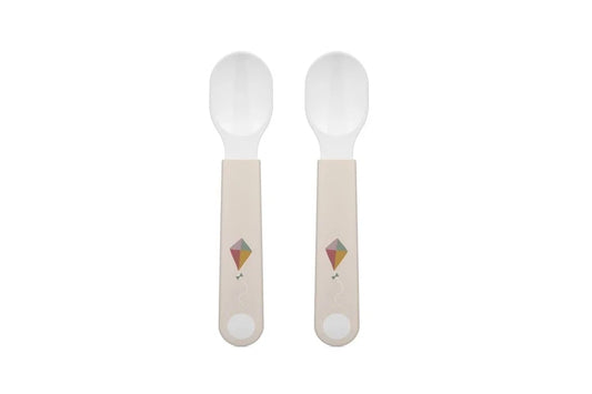 Two spoons with light-colored handles on a white background
