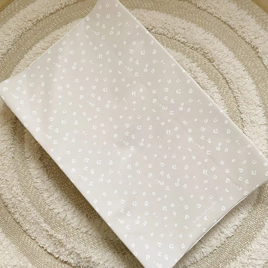 Bobbin and Bumble Anti-Roll Wedge Baby Changing Mat - Sand Animal Print